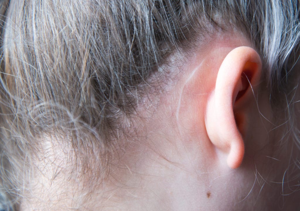 close up of woman's ear